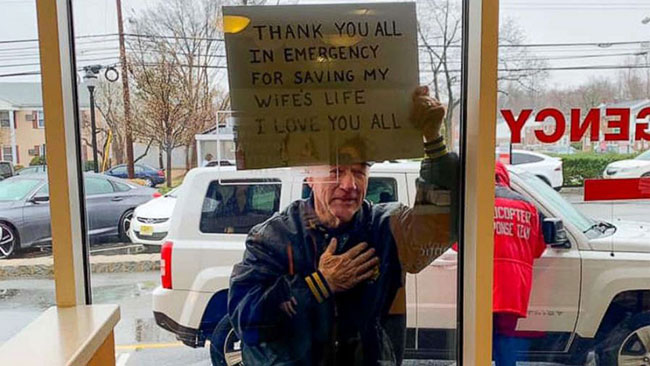 Eisenhower_Man_Holds_Sign_Thanking_Healthcare_Workers