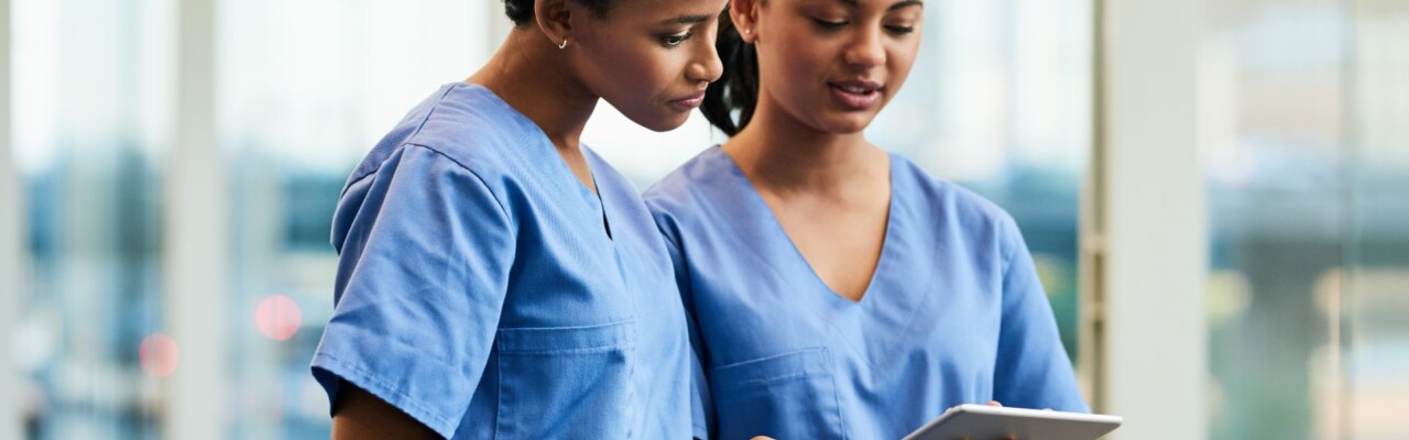 Nurses looking at tablet for nursing apps