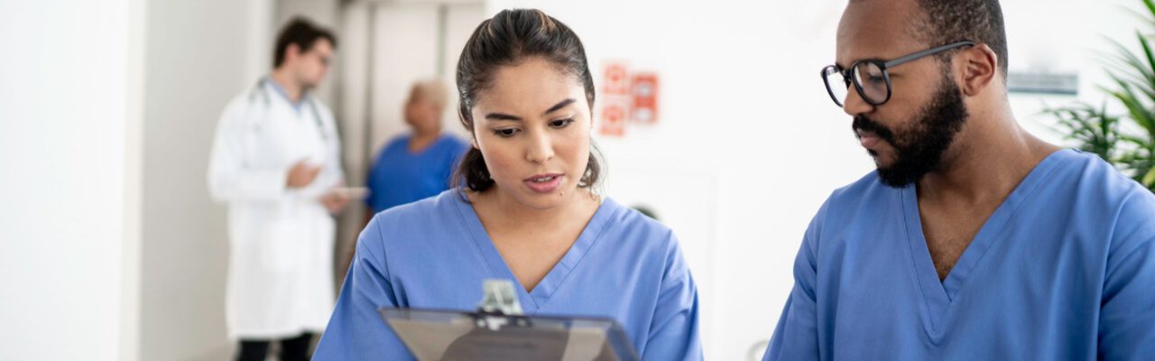 Quality assurance nurse checking patient chart