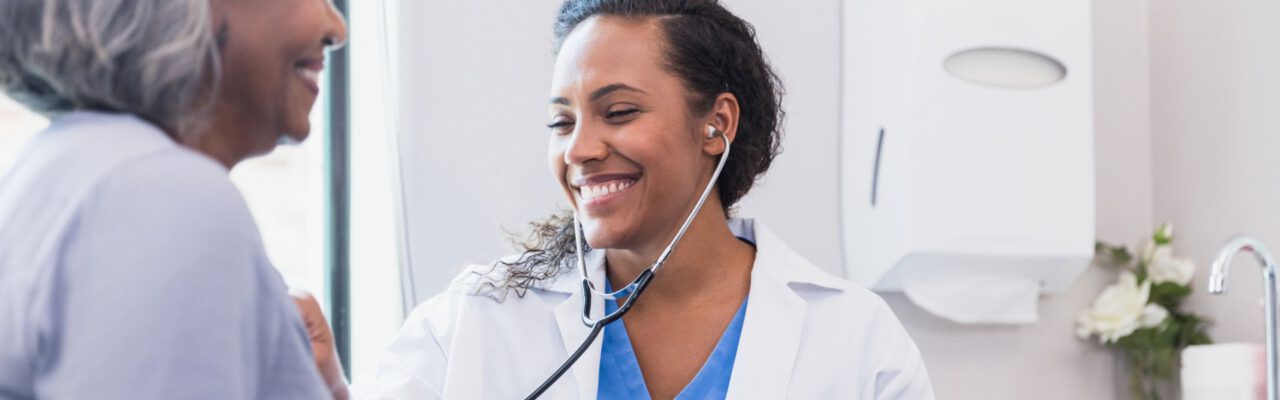 Doctor listening to patient's heart