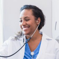 Doctor listening to patient's heart