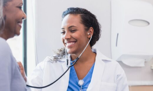 Doctor listening to patient's heart